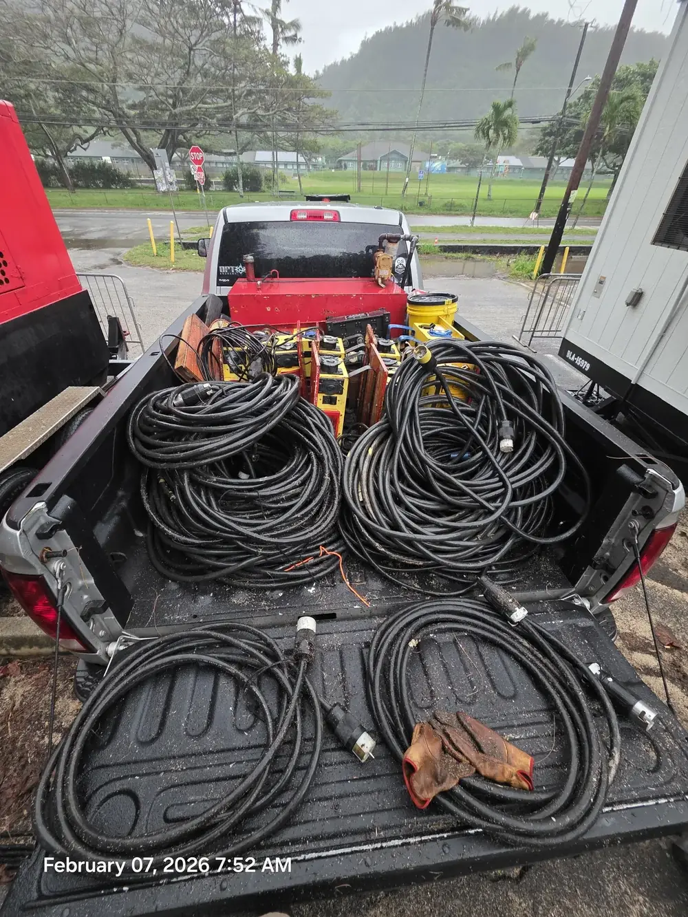 Coiled power cables in a truck bed