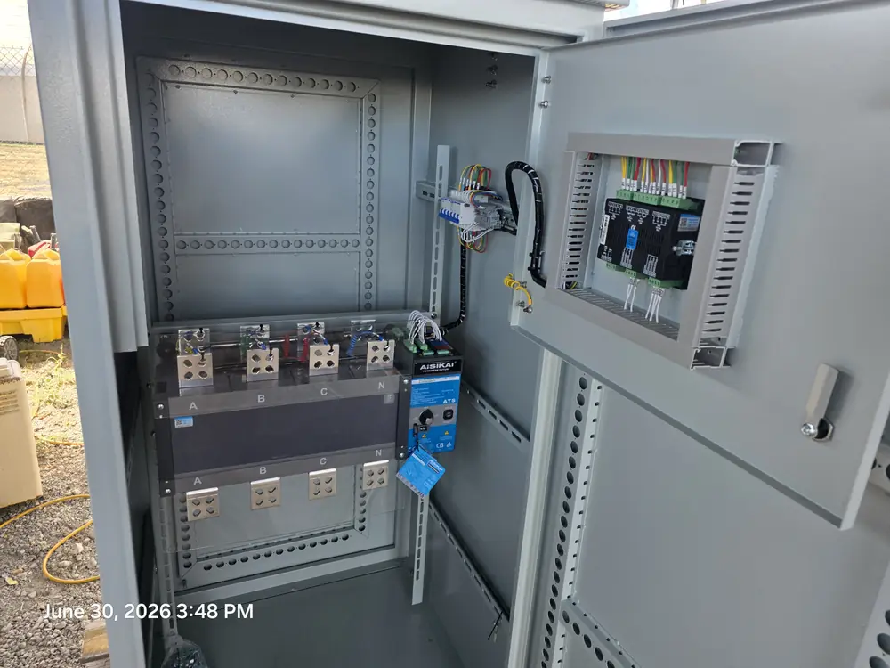 Open generator control cabinet with breakers and controller