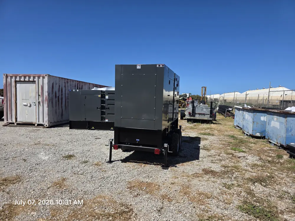 Enclosed generator on a trailer in a yard